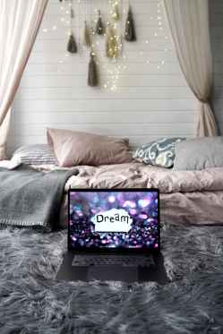 Bed, and laptop with word 'Dream'